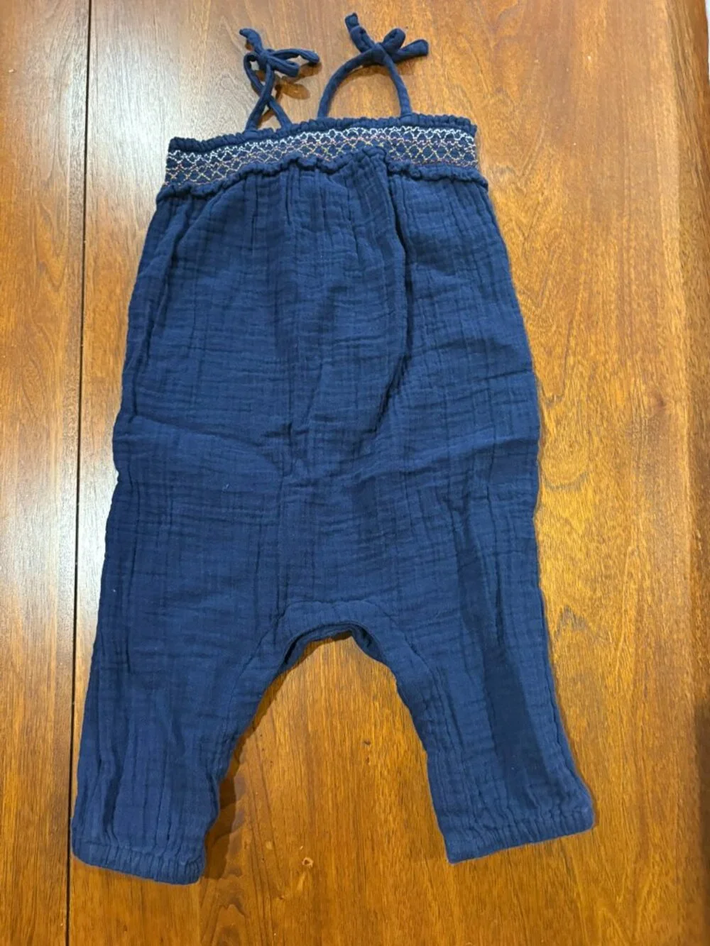 Old Navy navy romper with smocking, ties, snaps, size 12-18 months